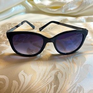 “Olivia” Sunglasses by Tommy Hilfiger. Black frames with bluish lenses.